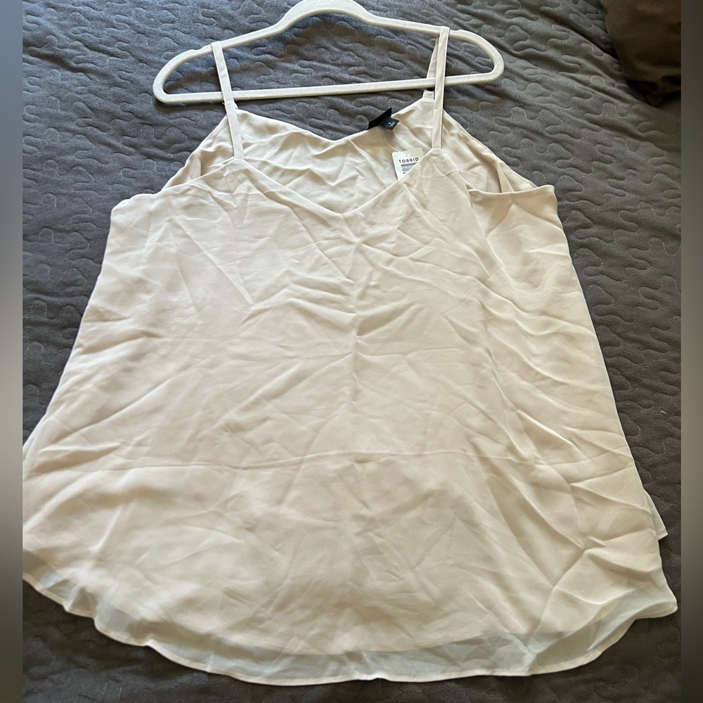 Torrid size 1x in a tan color. Brand new with tag